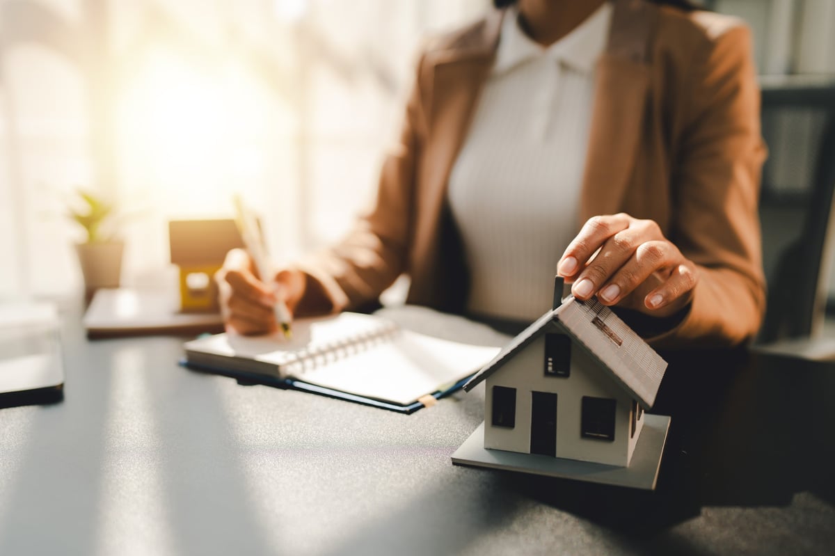 Real estate agent delivering property documents to a customer