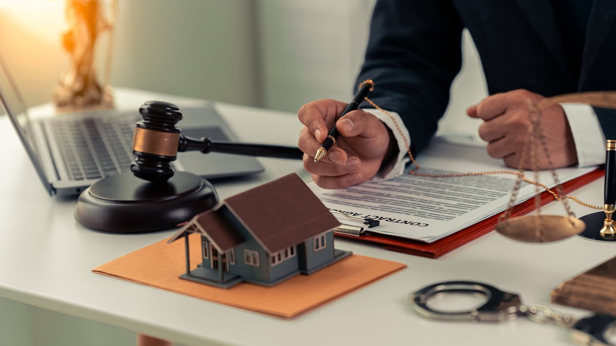 Real estate contract documents being signed