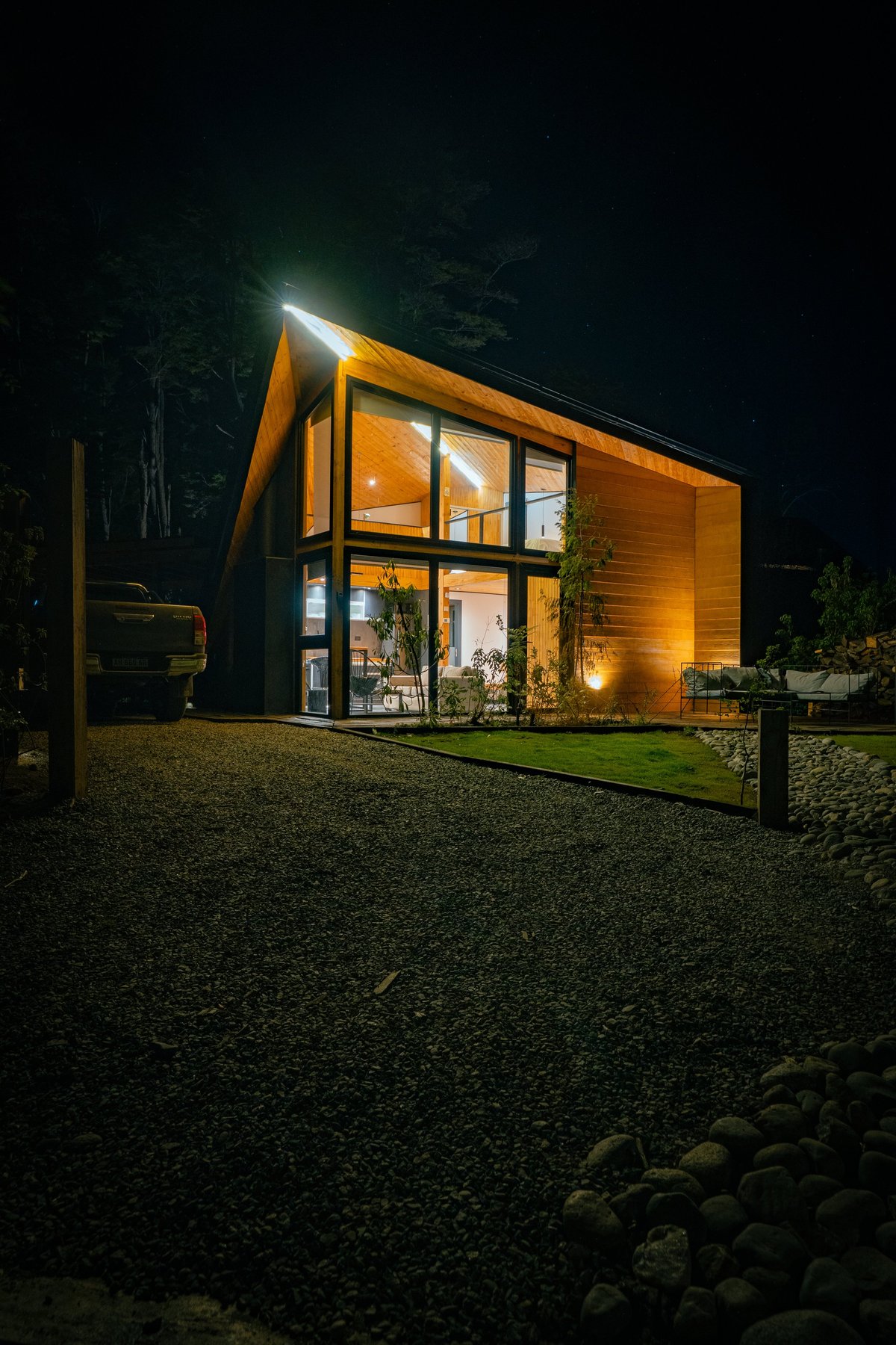Modern home warmly illuminated at night